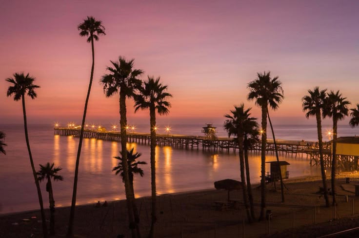 California pier silhouetted by violet dusk — from Din Tanovic's travel mood collection