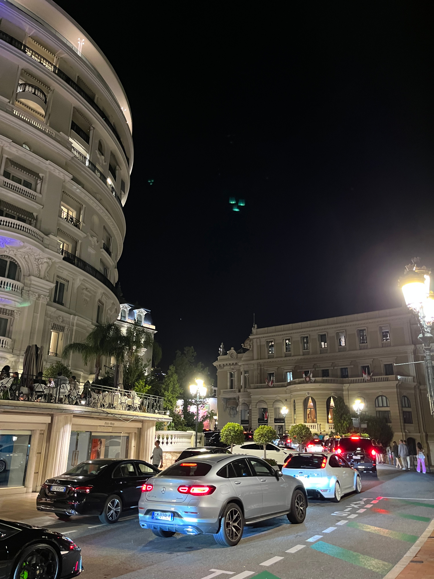 Din Tanovic — Place du Casino at night, Hôtel de Paris and slow traffic between the lamps