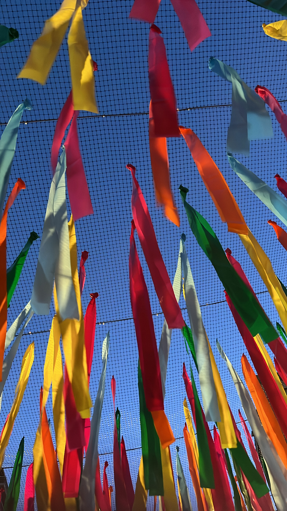 Din Tanovic — colorful ribbons at the Monaco festival, blue sky above
